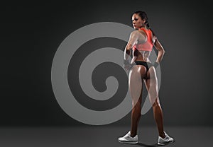 Athletic woman showing muscles of the back