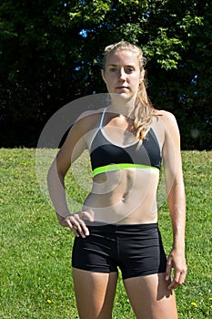 Athletic woman in a sports bra and shorts