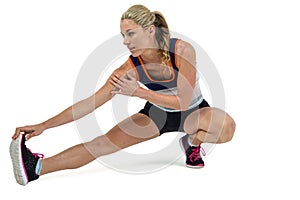 Athletic woman stretching her hamstring