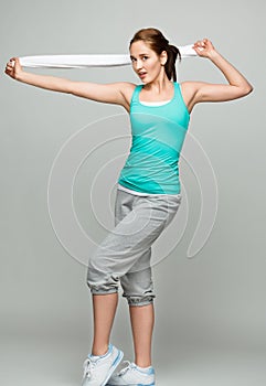 athletic woman stretching in studio