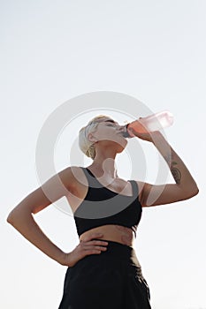 Athletic woman taking a break from fitness training