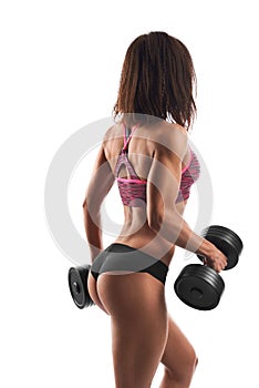 Athletic woman working out with dumbbells