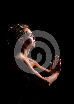 Athletic young blonde woman doing yoga practice isolated on white background.