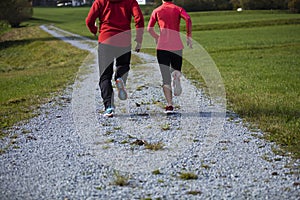 Athletic young couple running outdoors