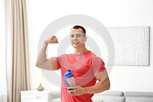 Athletic young man with protein shake