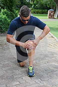 Athletic Young Man with Sore Knee