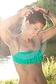 Athletic young woman combing herself