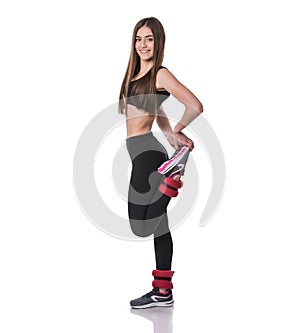 Athletic young woman doing aerobics exercise in fitness gym isolated over white background.