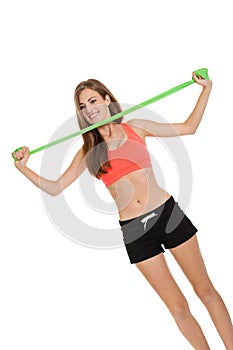 Athletic young woman doing workout with physio tape latex tape