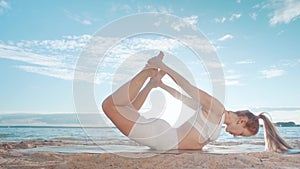 athletic young woman practicing yoga. Compass pose , fold , hamstring stretch.