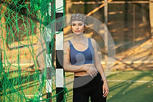 Athletic young woman in sportswear jogging in the park. Sport fitness model caucasian ethnicity training outdoor.