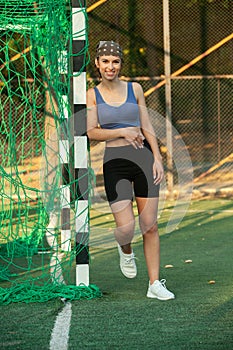 Athletic young woman in sportswear jogging in the park. Sport fitness model caucasian ethnicity training outdoor.