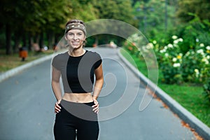 Athletic young woman in sportswear jogging in the park. Sport fitness model caucasian ethnicity training outdoor.