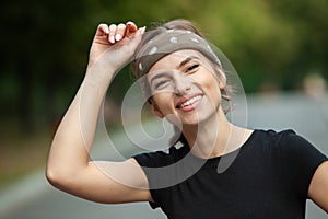 Athletic young woman in sportswear jogging in the park. Sport fitness model caucasian ethnicity training outdoor.