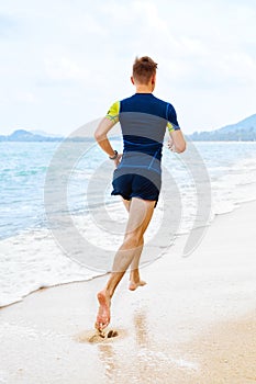 Athletics. Fit Athlete Jogger Running On Beach. Workout. Sports, Fitness.