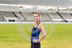 Athletics is my life. Cropped portrait of an attractive young female athlete standing with her hands on her hips at the