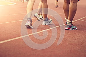 Athletics people walking exercise on the track field outdoor.