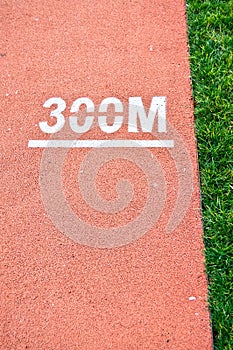 Athletics running track and grasses in a stadium. Begin, backdrop.