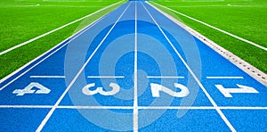 Athletics stadium running track blue lines marks.