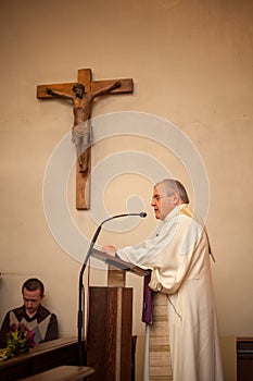 Atholic Priest On Altar Praying During Mass