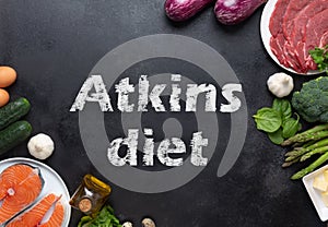 Atkins Diet food ingredients on balck chalkboard, health concept, top view with copy space. Concept with text