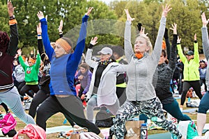 Women Do Warrior Pose At Massive Atlanta Outdoor Yoga Class