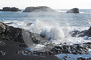 Atlantic coast, waves breaking on the volcanic basalt rocks, Dyrholaey view point, Iceland