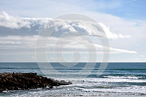 Atlantic ocean beach. Cloudy and wonderful sky. Portugal Almada. Europe. photo