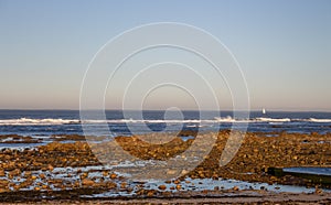 Atlantic Ocean coast in Portugal, Europe. Morning beach with rocks. Beach at sunset. Seascape at dawn. Summer evening coastline.