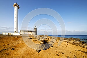 Atlantic ocean lanzarote lighthouse and rock the blue sky