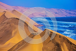 The Atlantic Ocean, moving sand dunes, Namibia