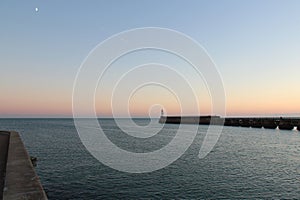 atlantic ocean, pier and lighthouse in la chaume in vendÃ©e (france) photo