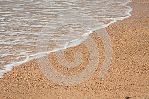 Atlantic Ocean waves come rolling in on a beach in England UK