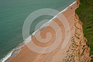 Atlantic Ocean waves come rolling in on a beach in England UK