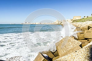 Atlantic waves crushing the waterbreaks in Cadiz, Andalusia, Spa