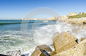 Atlantic waves crushing the waterbreaks in Cadiz, Andalusia, Spa