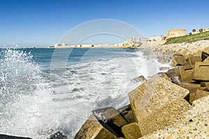 Atlantic waves crushing the waterbreaks in Cadiz, Andalusia, Spa