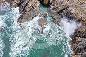 Atlantic waves splash against the rock at the Donegal coast in Ireland
