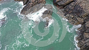 Atlantic waves splash against the rock at the Donegal coast in Ireland