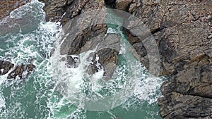 Atlantic waves splash against the rock at the Donegal coast in Ireland