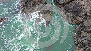 Atlantic waves splash against the rock at the Donegal coast in Ireland