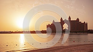 Atlantis, The Palm is a resort complex on artificial island Palm Jumeirah, Dubai. Sunset landscape.