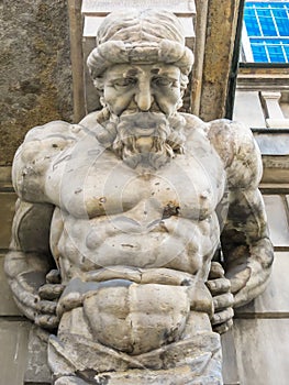 Atlas statue holding a portico