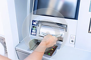 Atm card machine cash. Holding american bill cash. Woman withdraw money usd hundred dollar. Bank credit card money