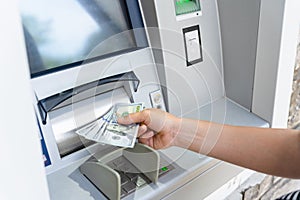 Atm machine money cash. Woman withdraw money bill. Holding american hundred dollar cash. Bank credit card and dollar