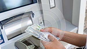 Atm machine money cash. Woman withdraw money bill. Holding american hundred dollar cash. Bank credit card and dollar