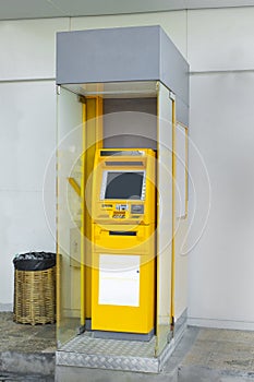 ATM withdraw cash at the side of the kiosk