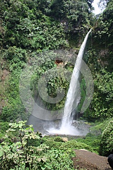 The atmosphere of the morning around the waterfall coban pelangi hill photo