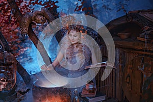 Atmospheric cold autumn photo in art processing, a good witch creates a magic elixir near his forest home, holding a