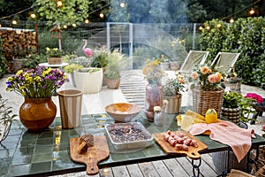 Atmospheric and cozy garden with dining place at dusk